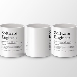 Three white mugs with "Software Engineer" definition printed in black text.