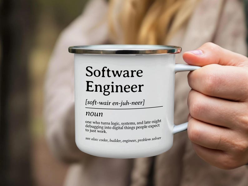 Enamel mug with "Software Engineer" definition text.