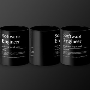 Three black mugs with "Software Engineer" definition printed on them.