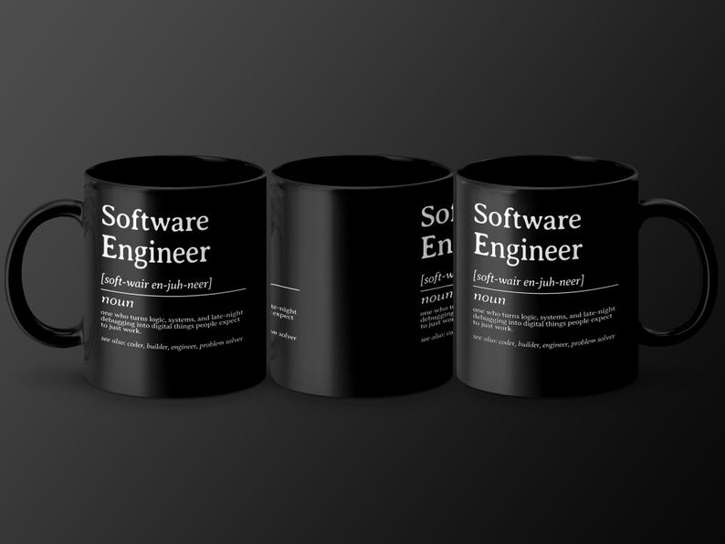 Three black mugs with "Software Engineer" definition printed on them.