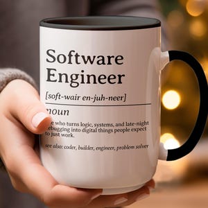 Mug with "Software Engineer" definition, held by a hand.