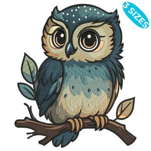 May include: An embroidered owl design in shades of blue, tan, and brown, perched on a branch with leaves. The owl has large, expressive eyes and is labeled with "3 SIZES". This design is suitable for various craft projects.