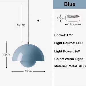 May include: A blue pendant light with a spherical design. The light fixture is 16 cm high, 23 cm wide, and hangs from a 150 cm cord. The light source is LED with a 9W power output. The color is warm light. The material is metal and ABS.