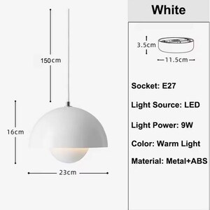 May include: White pendant light with a dome-shaped shade, 23cm in diameter and 16cm high. The light hangs from a 150cm cord. Features LED light source, 9W light power, and warm light color. Made of metal and ABS.