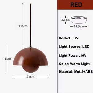 May include: A red, dome-shaped pendant light with a spherical bottom. The light is 16 cm high, 23 cm wide, and hangs from a 150 cm cord. The light source is LED, with a 9W power output and a warm light color. The socket is E27.