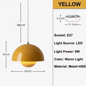 May include: A yellow pendant light with a dome-shaped shade, 9W light power, and a warm light color. The light is 16 cm high, 23 cm wide, and hangs from a 150 cm cord. The socket is E27.