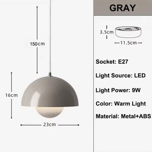 May include: A gray pendant light with a hemispherical shade, 23 cm in diameter, and a spherical light source. The light hangs from a 150 cm cord. The light source is LED with 9W of power and a warm light color. The material is metal and ABS.