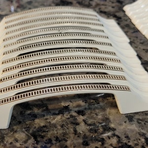 May include: A rustic wooden sign with the text "Welcome to our home" in a handwritten style. The sign features a distressed finish and a simple, inviting design, perfect for a front porch or entryway.