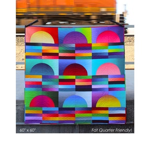 May include: A colorful quilt pattern with a geometric design featuring half circles and rectangles. The quilt is made with a variety of bright colors, including red, orange, yellow, green, blue, purple, and pink. The quilt is 60 inches by 60 inches and is labeled "Fat Quarter Friendly!"
