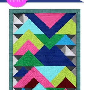 May include: A quilt pattern called "Overlap" by Charisma Horton. The pattern features a geometric design with overlapping triangles in shades of blue, green, pink, and yellow. The quilt is 72 inches by 96 inches or 36 inches by 48 inches.