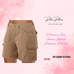 May include: Tan jean shorts with cargo pockets and a gold button closure. The shorts are displayed on a pink background with text that reads "Women's Jean Shorts Sewing Pattern PDF". The logo "Pintie Patterns" is also visible.