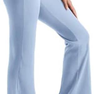 Light blue yoga pants with a flared leg design. The pants have a high waistband and are made of a smooth, stretchy material. The pants are shown with white sneakers.
