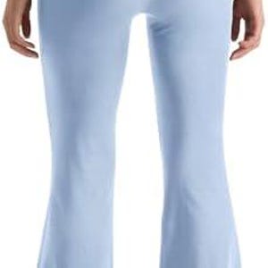 Light blue flared yoga pants. The pants have a high waistband and a flared leg design. The fabric appears to be soft and stretchy, suitable for yoga or other activities. The pants are shown from the back.