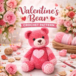 May include: A pink crochet bear with a heart on its chest, surrounded by flowers and yarn. The text "Valentine's Bear Crochet Pattern" is displayed above the bear. The bear has a light pink face and paws, with a brown nose and black eyes.