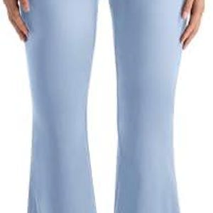Light blue flared yoga pants with a high waistband. The pants are made of a soft, stretchy material and have a flared leg opening. The pants are shown with white sneakers.