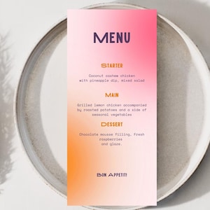 May include: A menu card with a gradient of pink and orange, featuring the word "MENU" in purple. The menu lists starter, main, and dessert options, including coconut cashew chicken and chocolate mousse. The words "Bon Appetit!" are at the bottom.