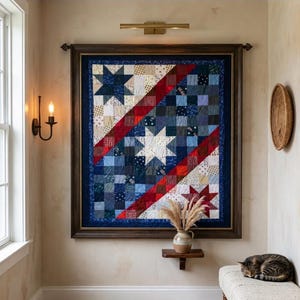 May include: A rectangular wall-mounted quilt featuring a patchwork design of blue, red, and cream fabric squares. The quilt displays three prominent star patterns arranged diagonally, framed by a dark wooden border with a blue fabric trim.