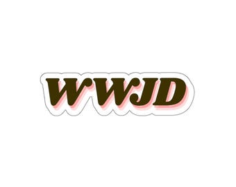 May include: A die-cut sticker featuring the acronym WWJD in a bold, dark brown, serif font. The letters are outlined with a thin, light pink shadow effect, followed by a white border that contours the shape of the text for a clean finish.