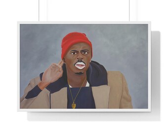 May include: A framed print featuring a portrait of a person wearing a red beanie, a tan coat, and a gold pendant. The person is pointing a finger towards their ear, with a serious expression. The background is a muted gray.