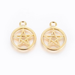 May include: Two gold-colored metal charms in the shape of a circle with a five-pointed star inside. The star is outlined and has a small loop at the top for attaching to a necklace or bracelet.