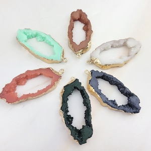 May include: Six agate slices with gold-plated edges and a hole for hanging. The slices are in various colors, including green, pink, white, brown, black, and dark green.