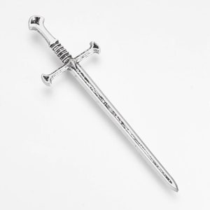 May include: A silver sword with a cross-shaped hilt. The sword is about 10 inches long and has a pointed tip.