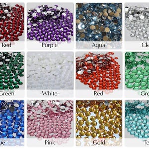 May include: A collection of colorful rhinestones in various shades, including dark red, purple, aqua, clear, dark green, white, red, green, blue, pink, gold, and teal. Each color is labeled with its name.
