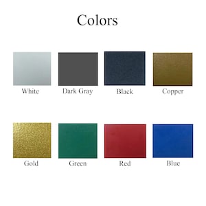 Puede incluir: Imagen que muestra una tabla de colores con la palabra "Colores" en la parte superior. La tabla muestra ocho muestras de color: blanco, gris oscuro, negro, cobre, dorado, verde, rojo y azul. Cada muestra est&aacute; etiquetada con su nombre de color.