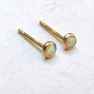 Tiny stud earrings White Opal solid gold stud earrings 2 mm
