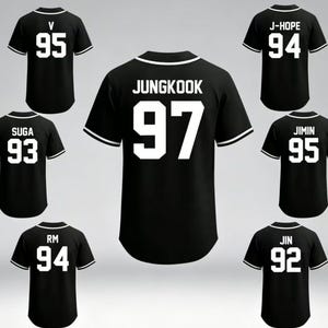 May include: Black baseball jerseys with white accents and player names and numbers. The jerseys feature names like JUNGKOOK, J-HOPE, and JIMIN, with numbers such as 97, 94, and 95. The jerseys are displayed against a light gray background.