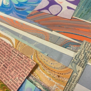 May include: A collage of colorful marbled paper samples with text snippets about the Louis Quinze period of French design. The text mentions the use of ornamentation and the style of architecture during this period.