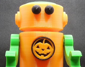 Halloween Robot Sculpture Art Toy. Spooky Decor for Trick or Treat. Features Pumpkin Symbol.