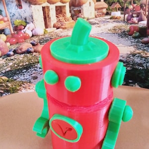 Toy Robot Sculpture of Red Hot Chili Pepper. Gift for Vegan, made from vegetable matter with plant based symbol on chest.