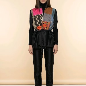 May include: A set of three ceramic nesting bowls in graduating sizes. The bowls feature a speckled, off-white glaze with a slightly textured surface. The largest bowl measures approximately 8 inches in diameter.