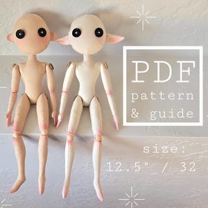 May include: Two fabric dolls with button eyes and jointed limbs. One doll is beige, the other is off-white. The image includes the text "PDF pattern & guide" and "size: 12.5" / 32 cm". The dolls have pink accents on their hands and feet.