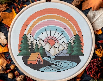 Retro Rainbow Camp – Colorful cross stitch pattern featuring mountains, tent, forest and a sunset rainbow for nature and hiking lovers.