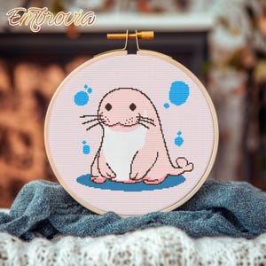 Cute pink walrus. Mysterious water dweller. Pink cartoon character. Easy multi-color embroidery pattern.