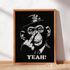 May include: Black and white framed artwork featuring a chimpanzee wearing a hat and suit, with a finger on its nose. The word "YEAH!" is displayed in bold white letters below the chimpanzee. The artwork is framed in a wooden frame.