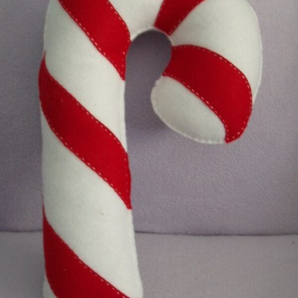 Beautiful handmade red and white candy cane novelty pillow.