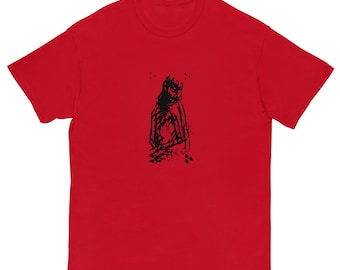 May include: Red short-sleeved t-shirt with a black and white graphic print of a person sitting down.