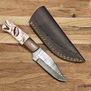 Handmade damascus steel knife, unique handle, leather sheath is included