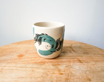 Handcrafted ceramic mug with a green fish design for coffee or tea, without a handle - carp, astrological animal symbol, handmade screen-printed