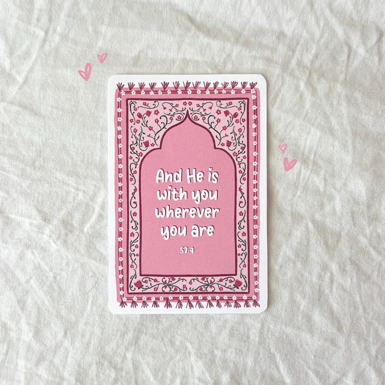 May include: A pink and white card with a floral design and the text "And He is with you wherever you are 57:4".