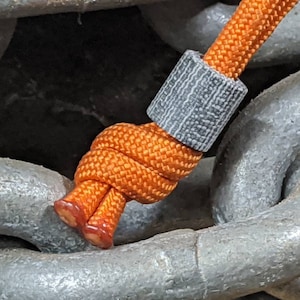 Cordón de lona Micarta de textura rugosa de color negro y cordón de paracord gratuito