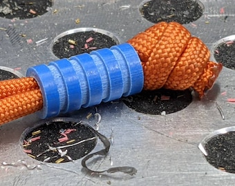 Medium Blue G10 Lanyard Bead With Four Grooves and a Free Paracord Lanyard