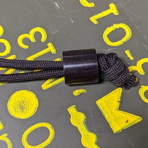 Cordón de acetal Delrin simple y grande y cordón de paracord gratis