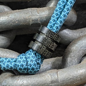 Large Black Micarta Lanyard Bead With Two Grooves and a Free Paracord Lanyard