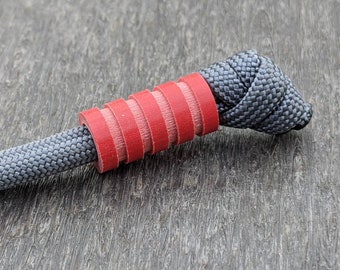 Medium Red G10 Lanyard Bead With Four Grooves and a Free Paracord Lanyard