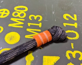 Medium Orange G10 Lanyard Bead With Two Grooves and a Free Paracord Lanyard