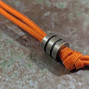Patinaed Large Brass Lanyard Bead With Two Grooves and a Free Paracord Lanyard
